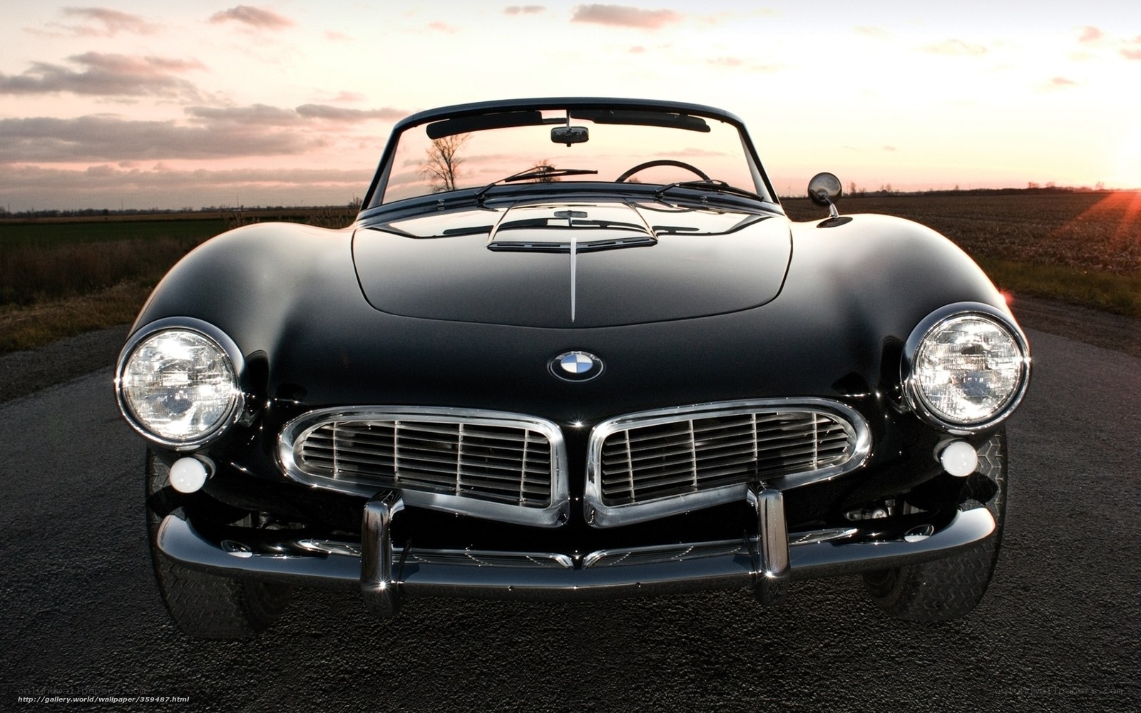 Black BMW 507 at sunset