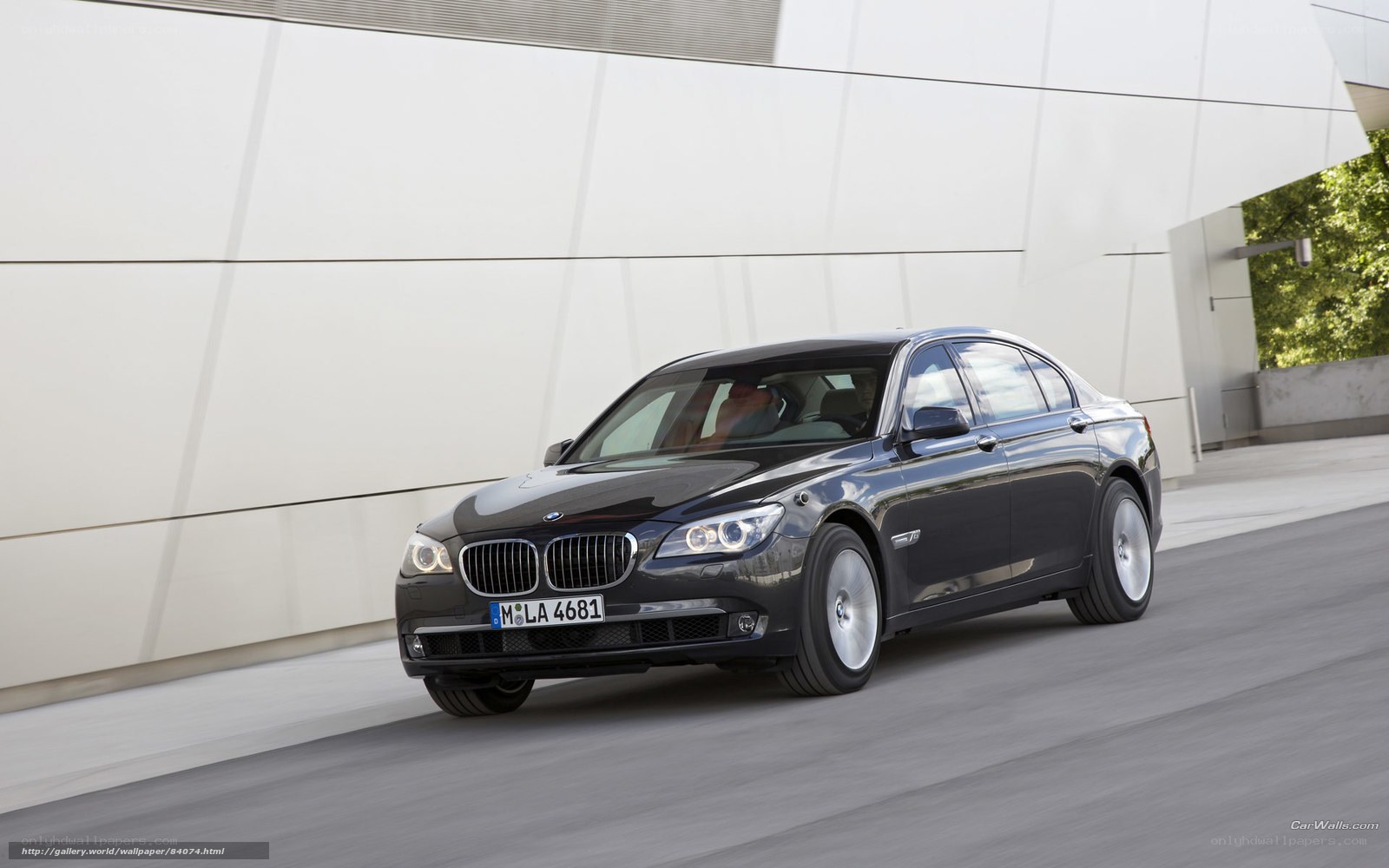 Black BMW 7 Series driving