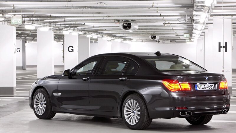Black BMW 7 Series in parking garage