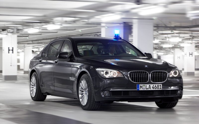 Black BMW 7 Series in parking garage