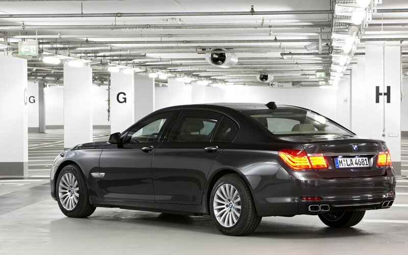 Black BMW 7 Series in parking garage