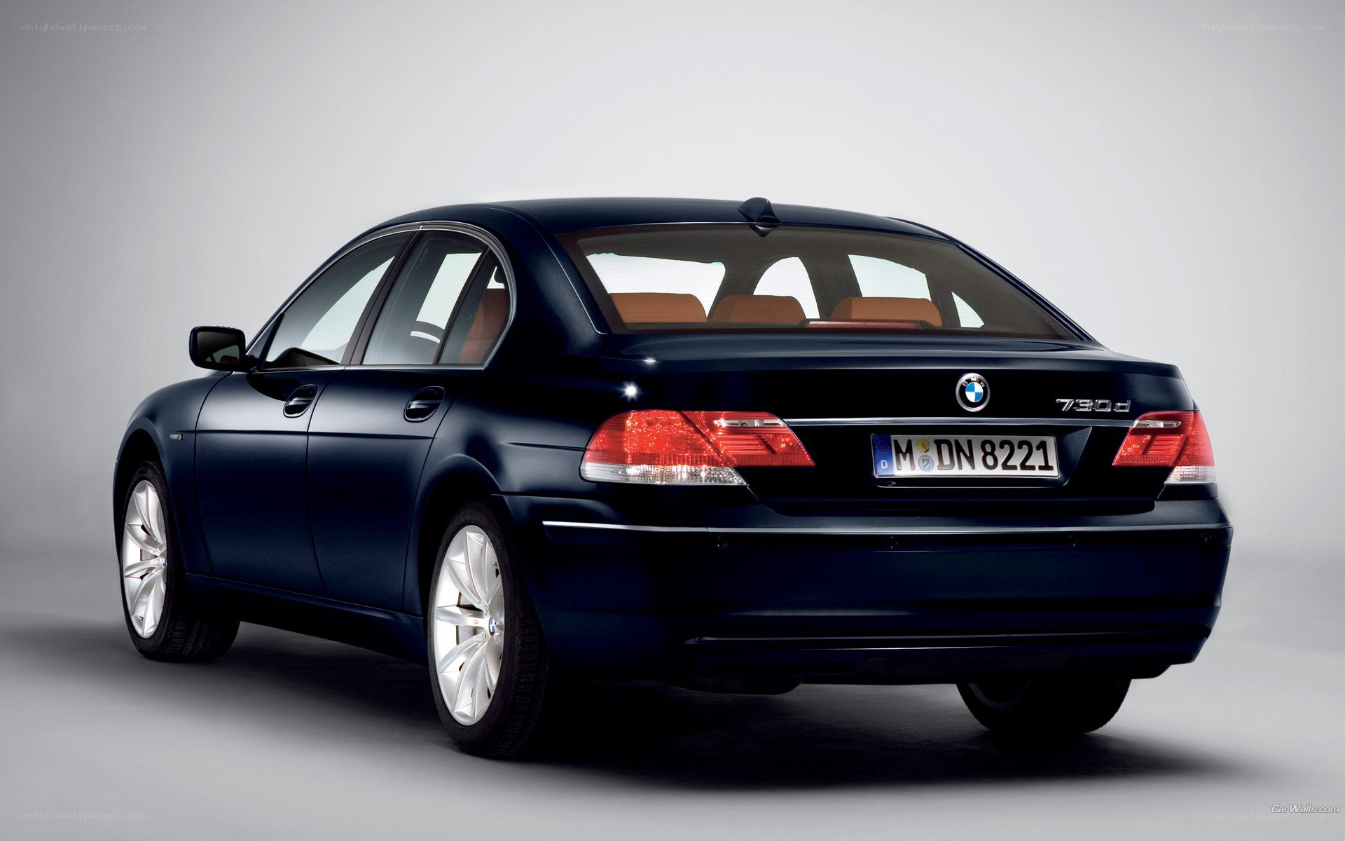 black bmw 730d sedan