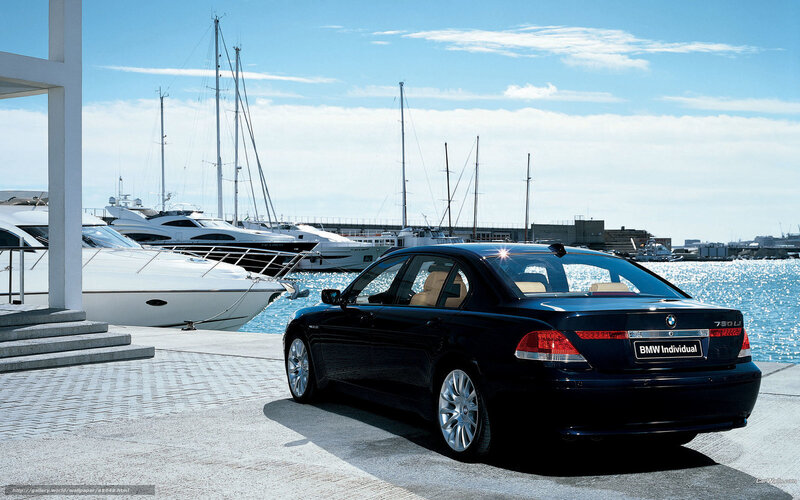 Black BMW 750Li at marina