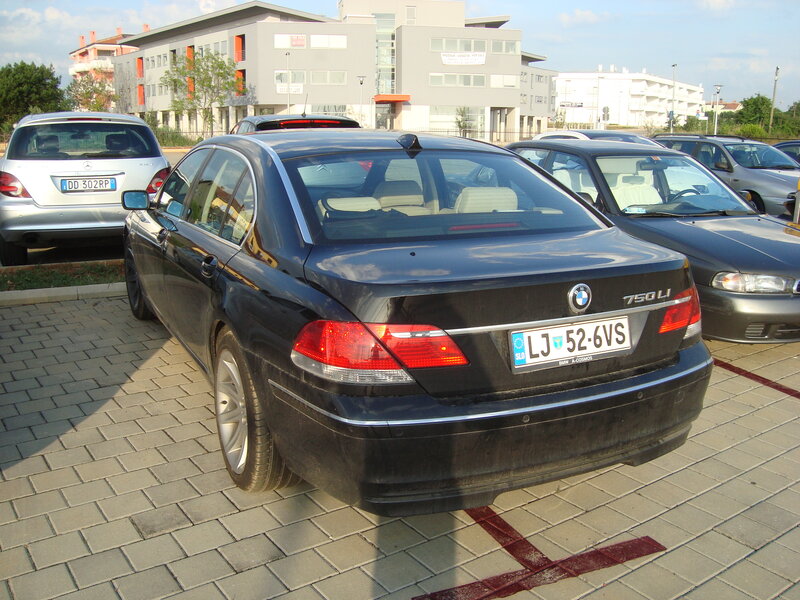 Black BMW 750Li in parking lot