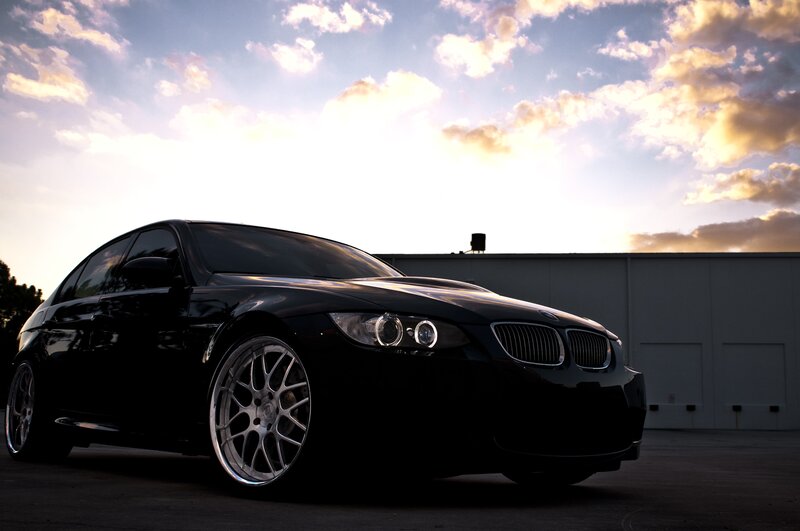 black bmw at sunset