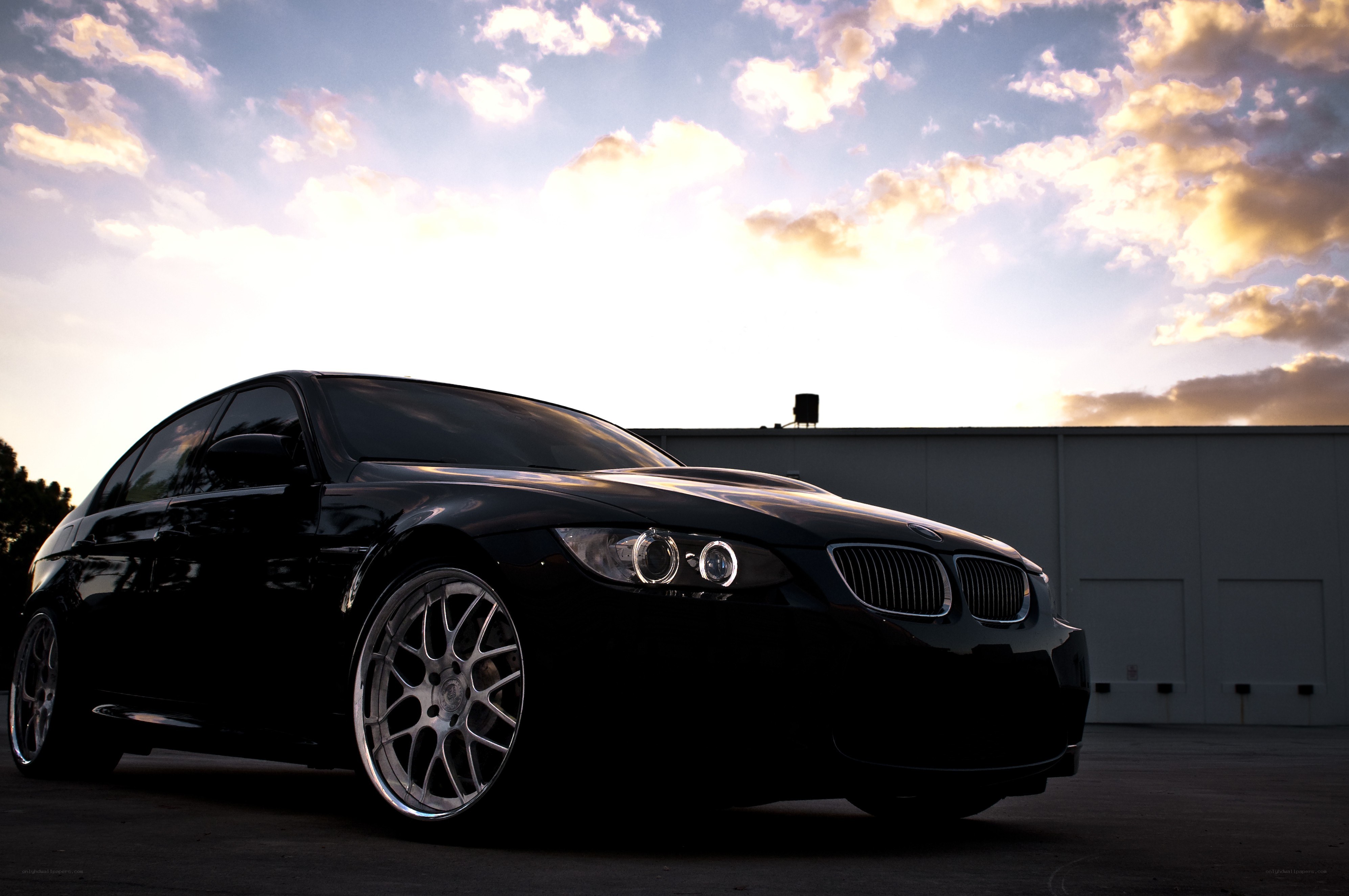 black bmw at sunset