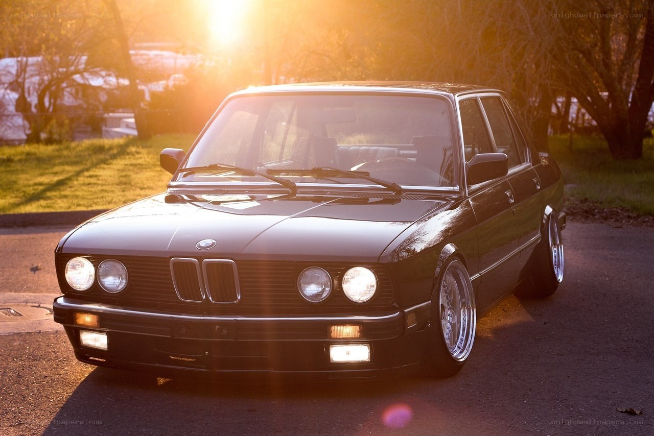 Black BMW at sunset
