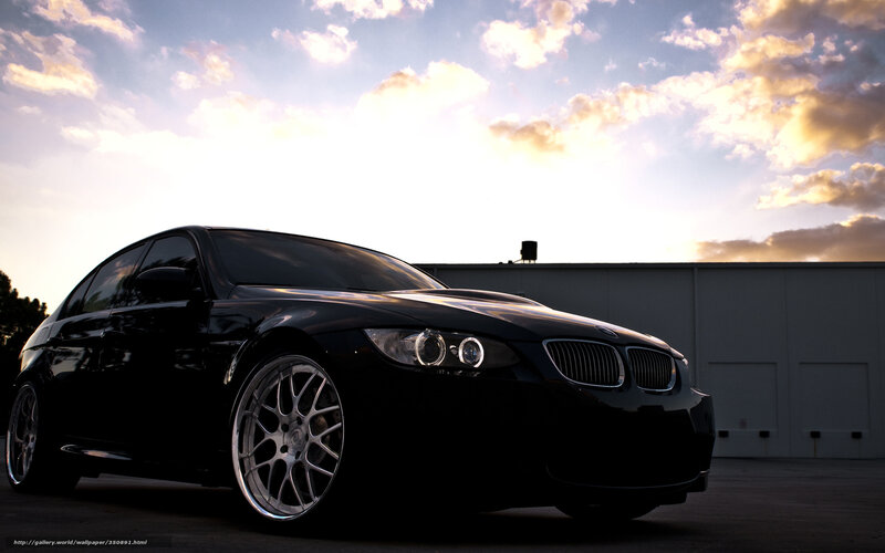 Black BMW at sunset