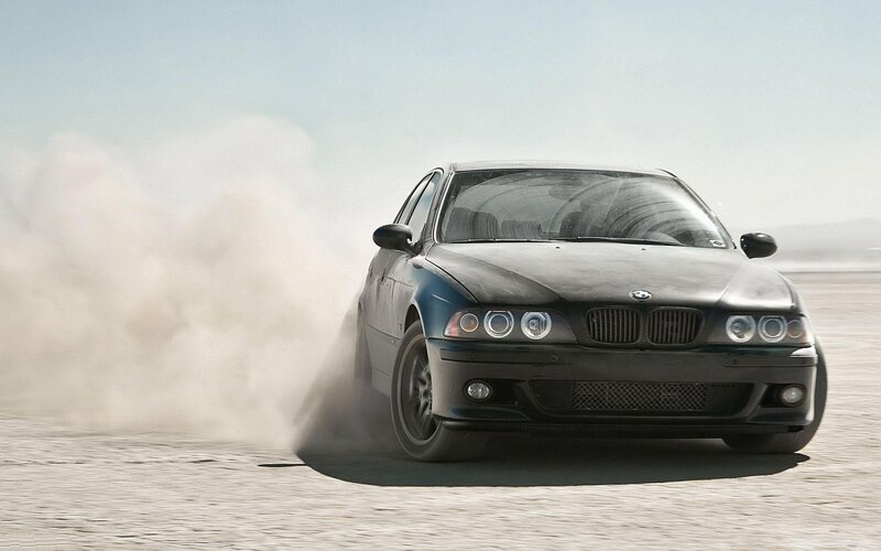 Black BMW Car — Dramatic, Afternoon, Photograph, Dust