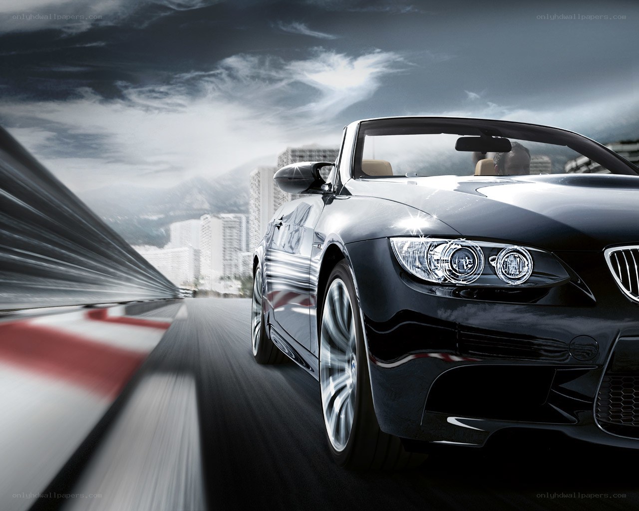 Black BMW convertible in motion