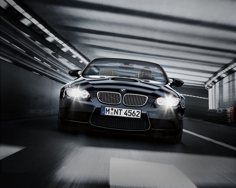 Black BMW convertible in tunnel