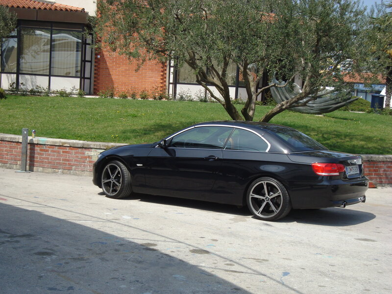 Black BMW convertible on street