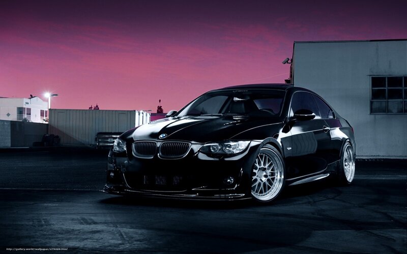black bmw coupe at dusk