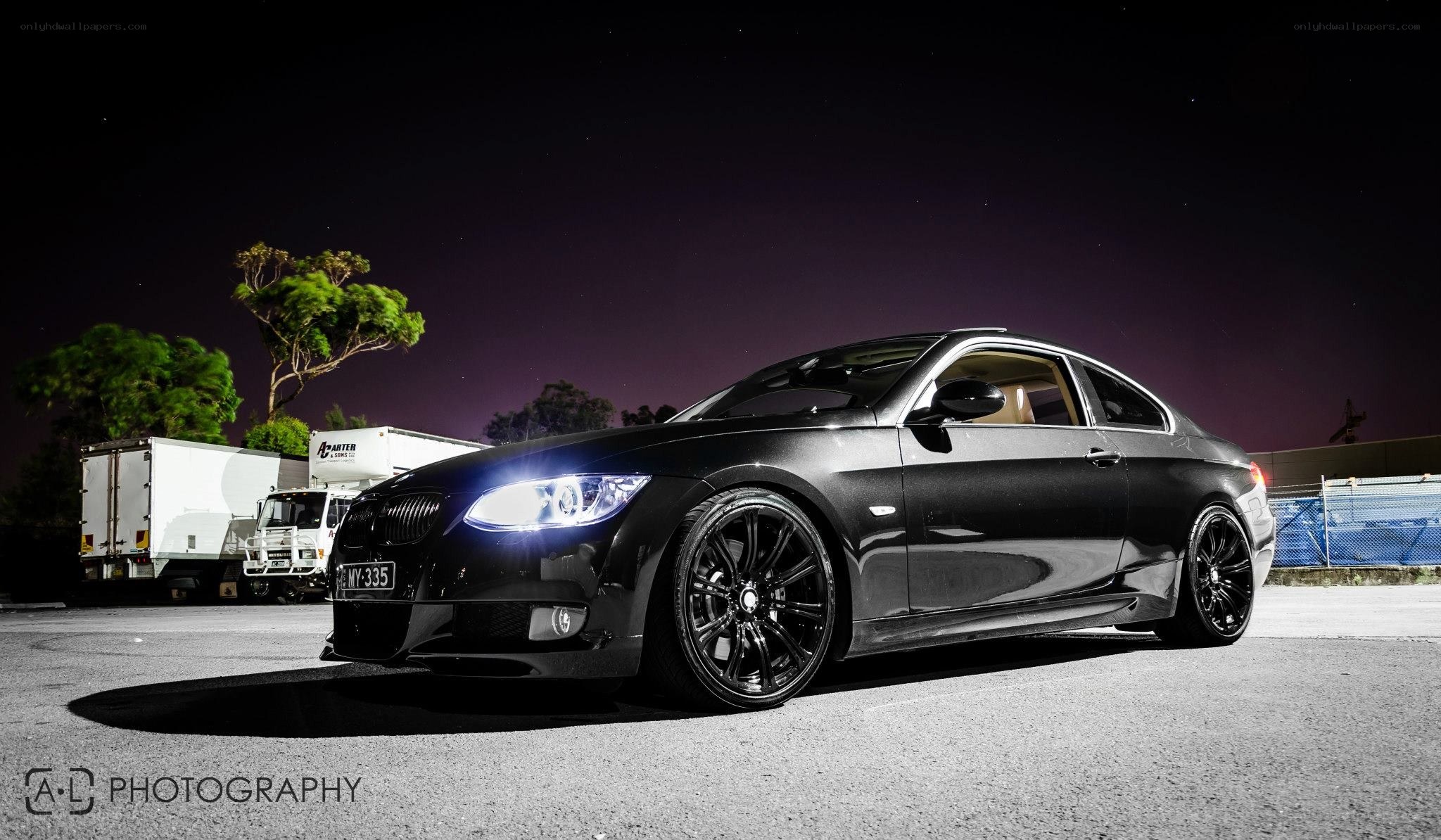 black bmw coupe at night