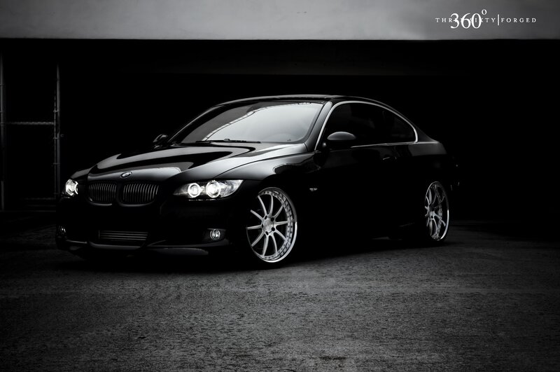 black bmw coupe in garage