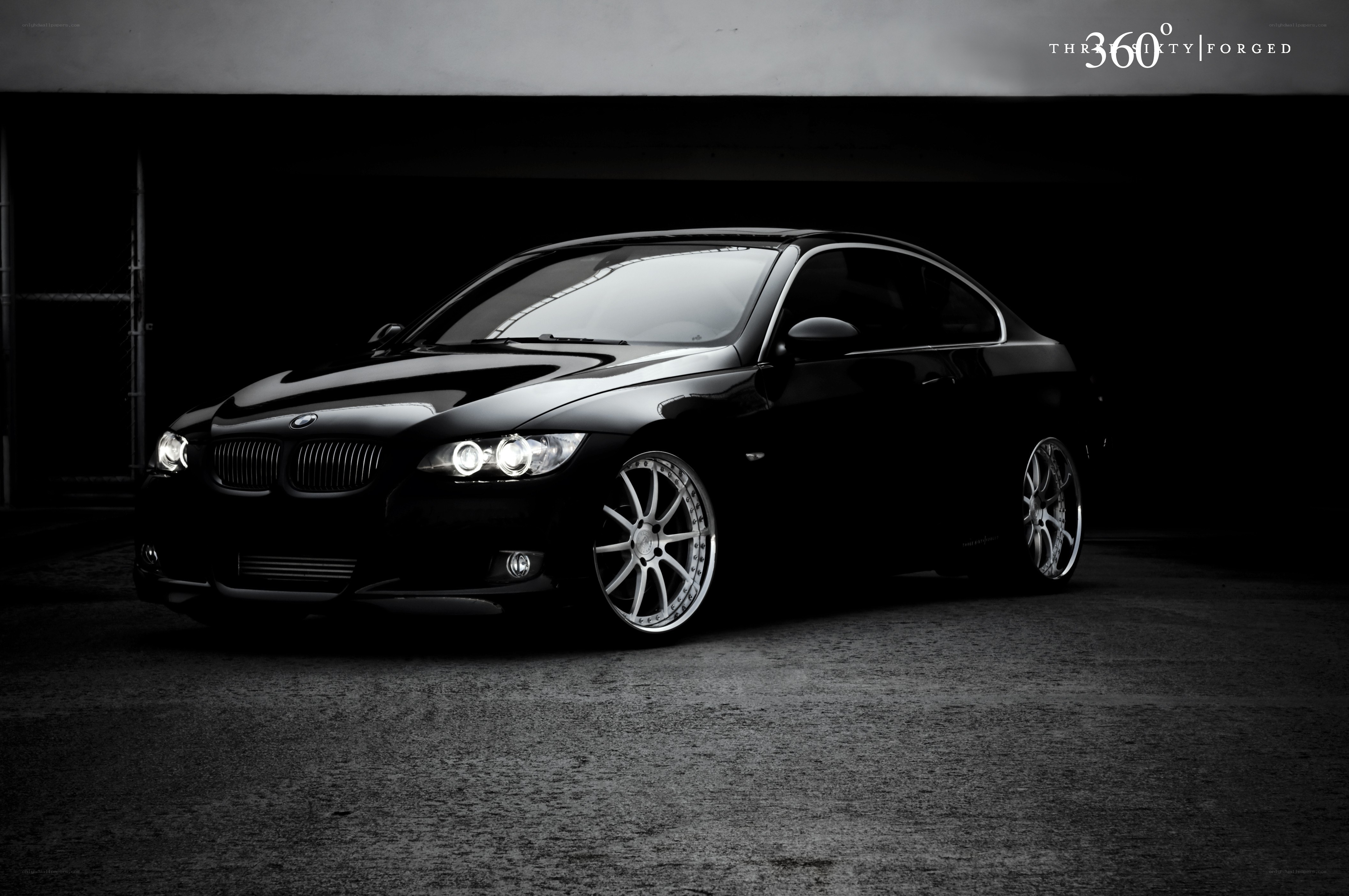 black bmw coupe in garage