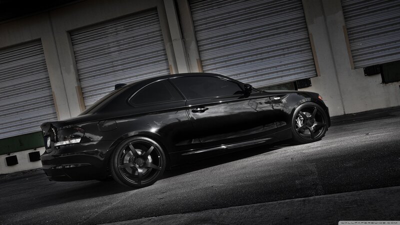 black bmw coupe in garage