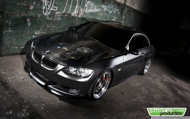 black bmw coupe in garage