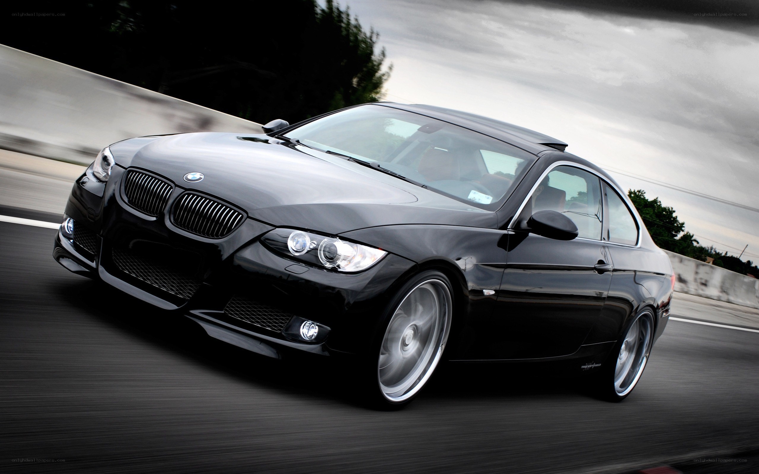 black bmw coupe in motion