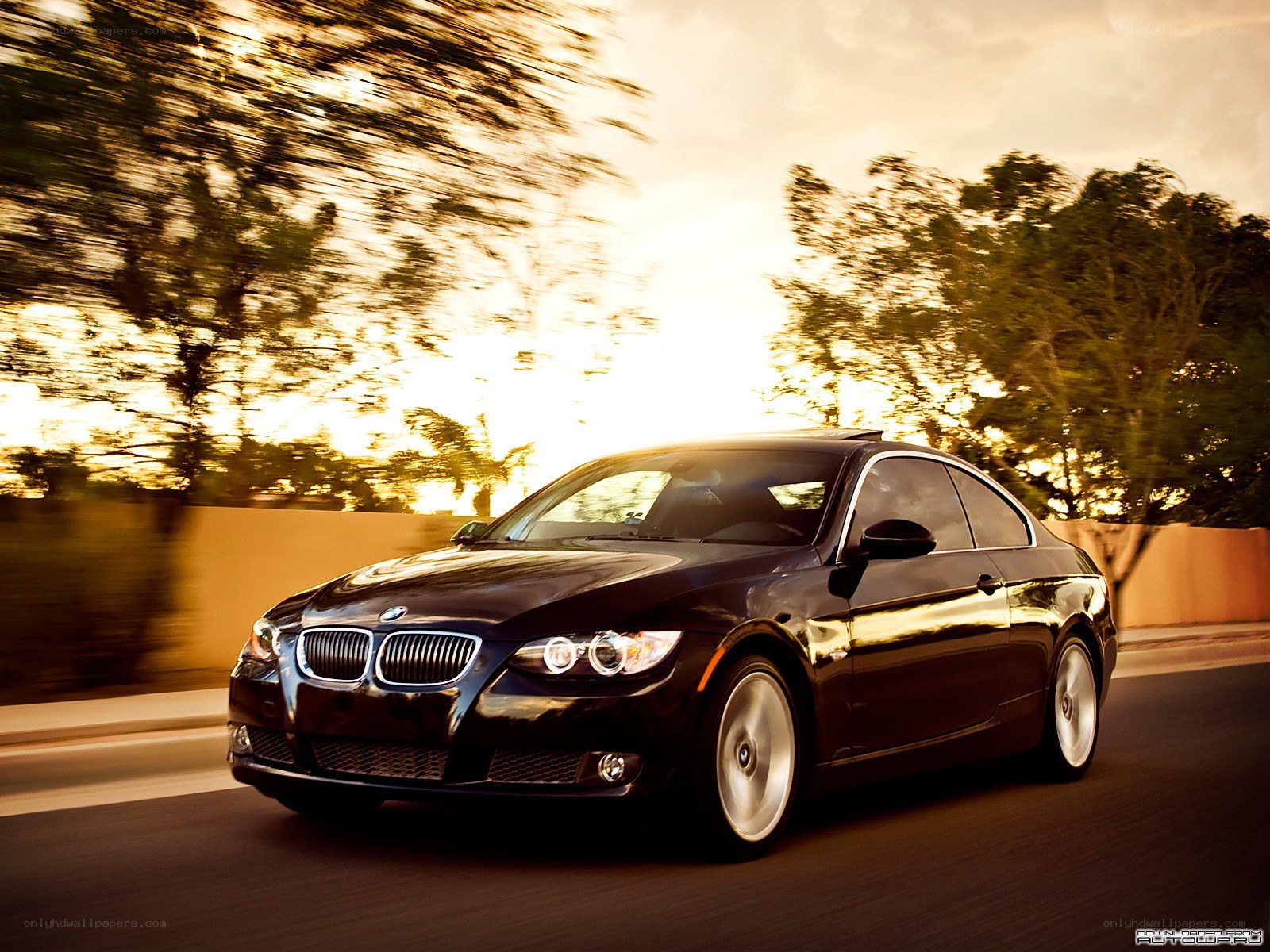black bmw coupe in motion