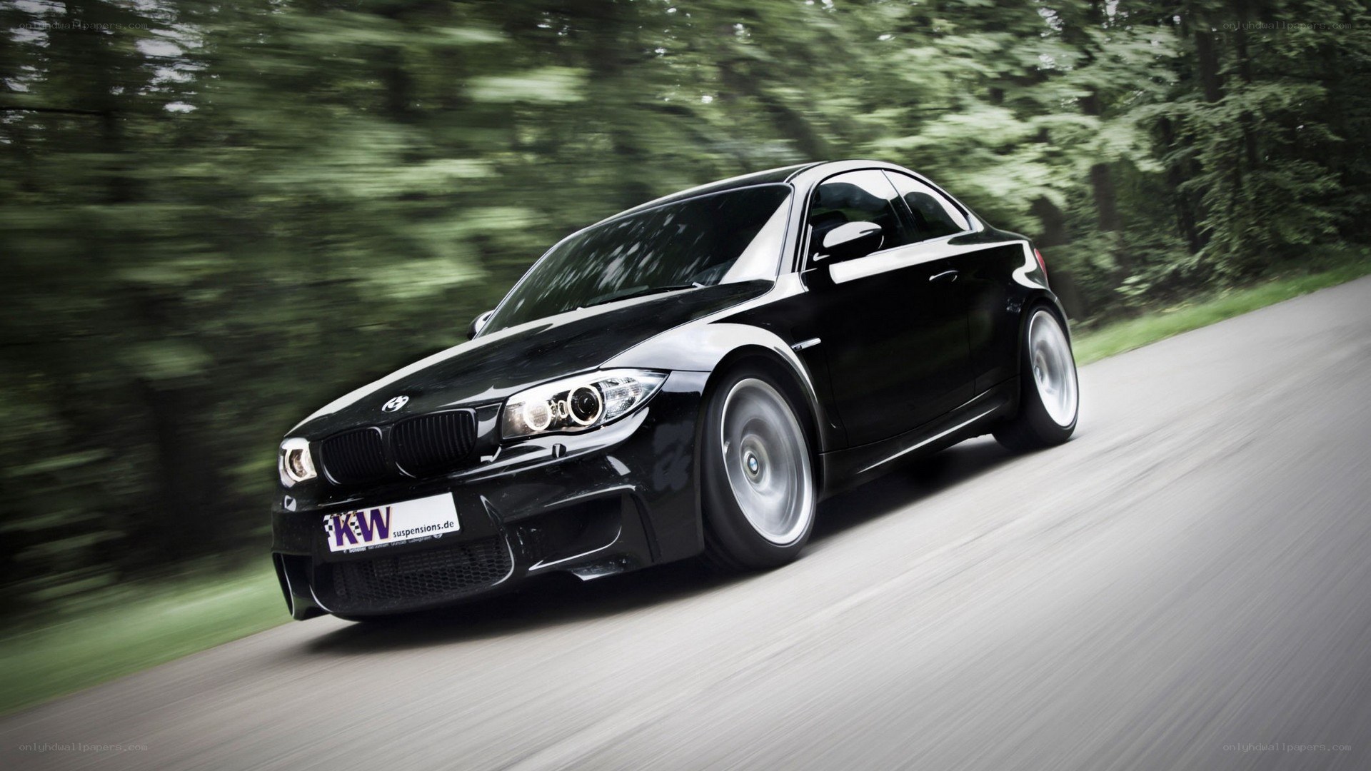 black bmw coupe in motion
