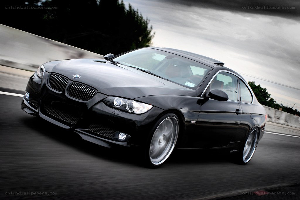 black bmw coupe in motion