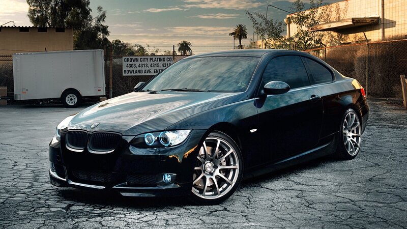 black bmw coupe in parking lot