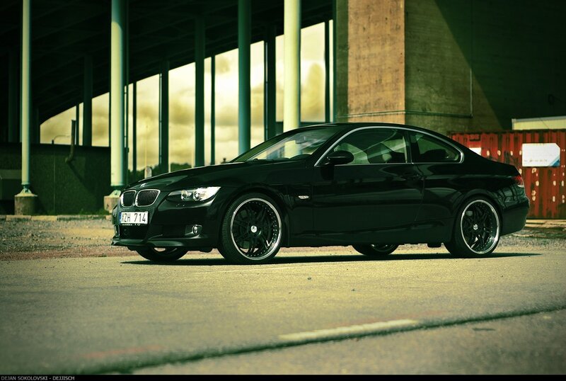 black bmw coupe in urban setting