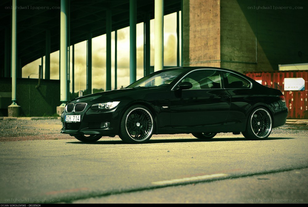 black bmw coupe in urban setting