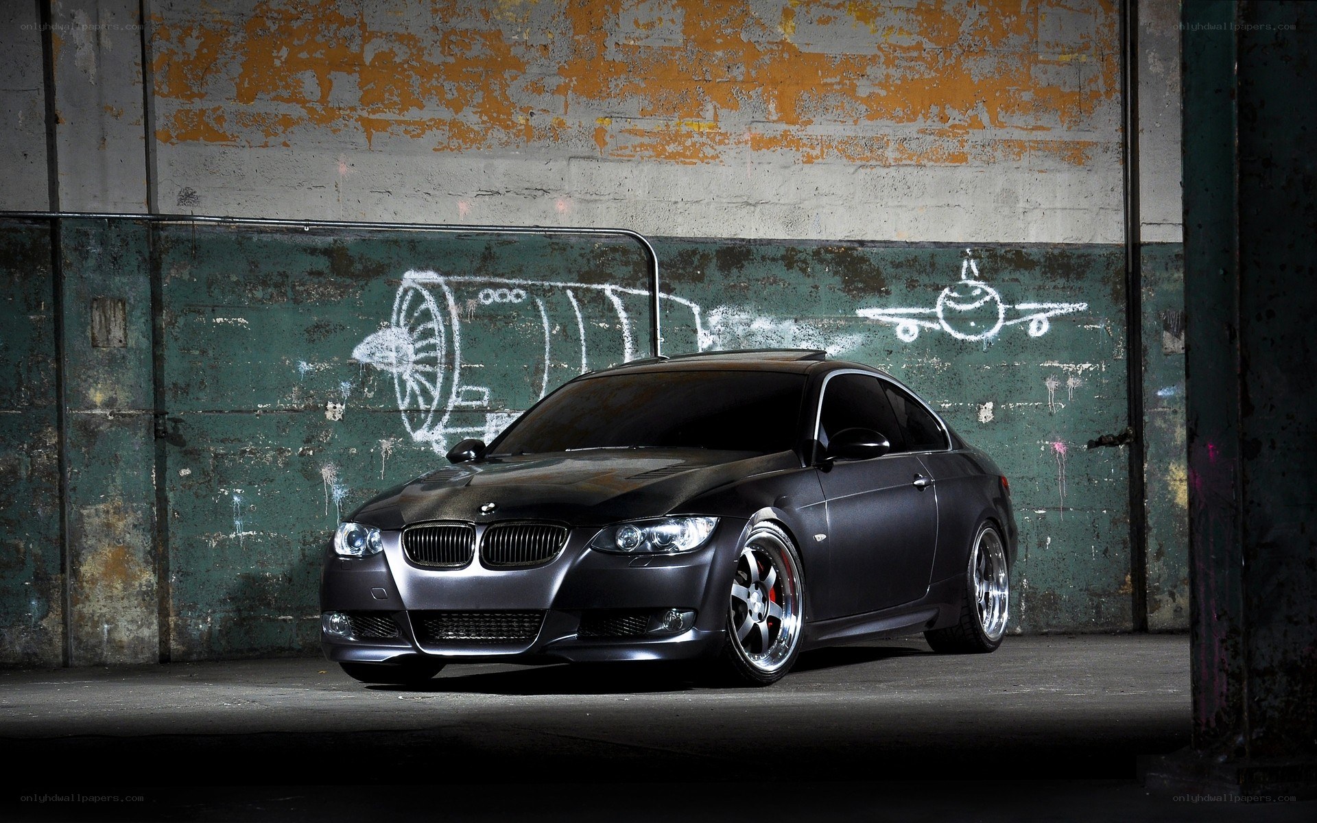 black bmw coupe in warehouse