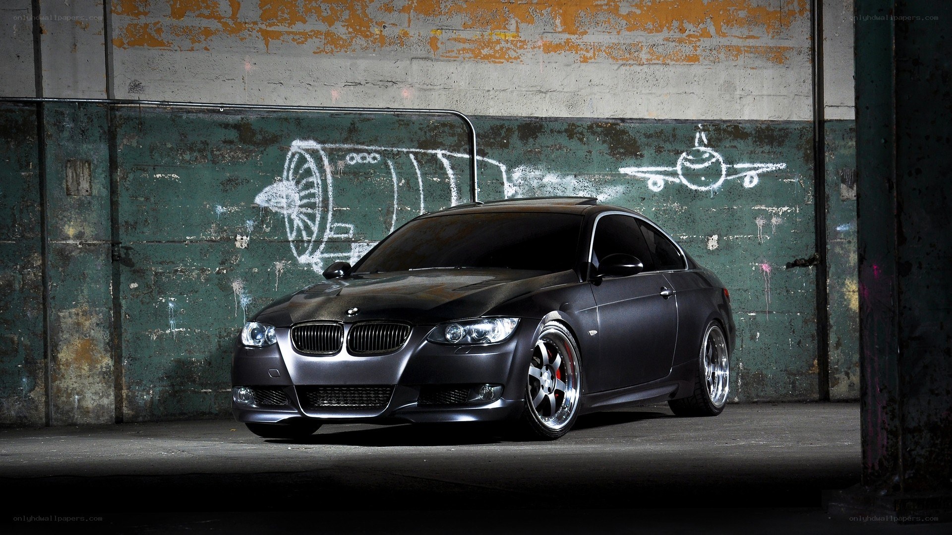 black bmw coupe in warehouse