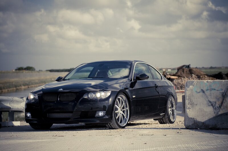 Black BMW coupe on a road