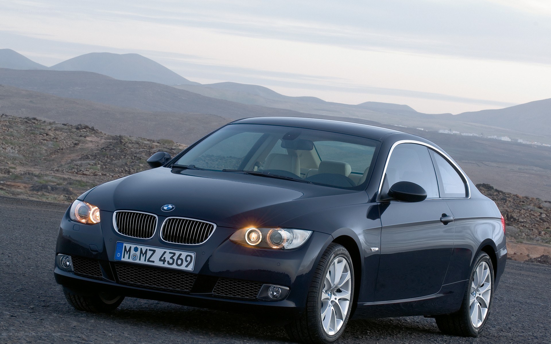 Black BMW coupe on a road