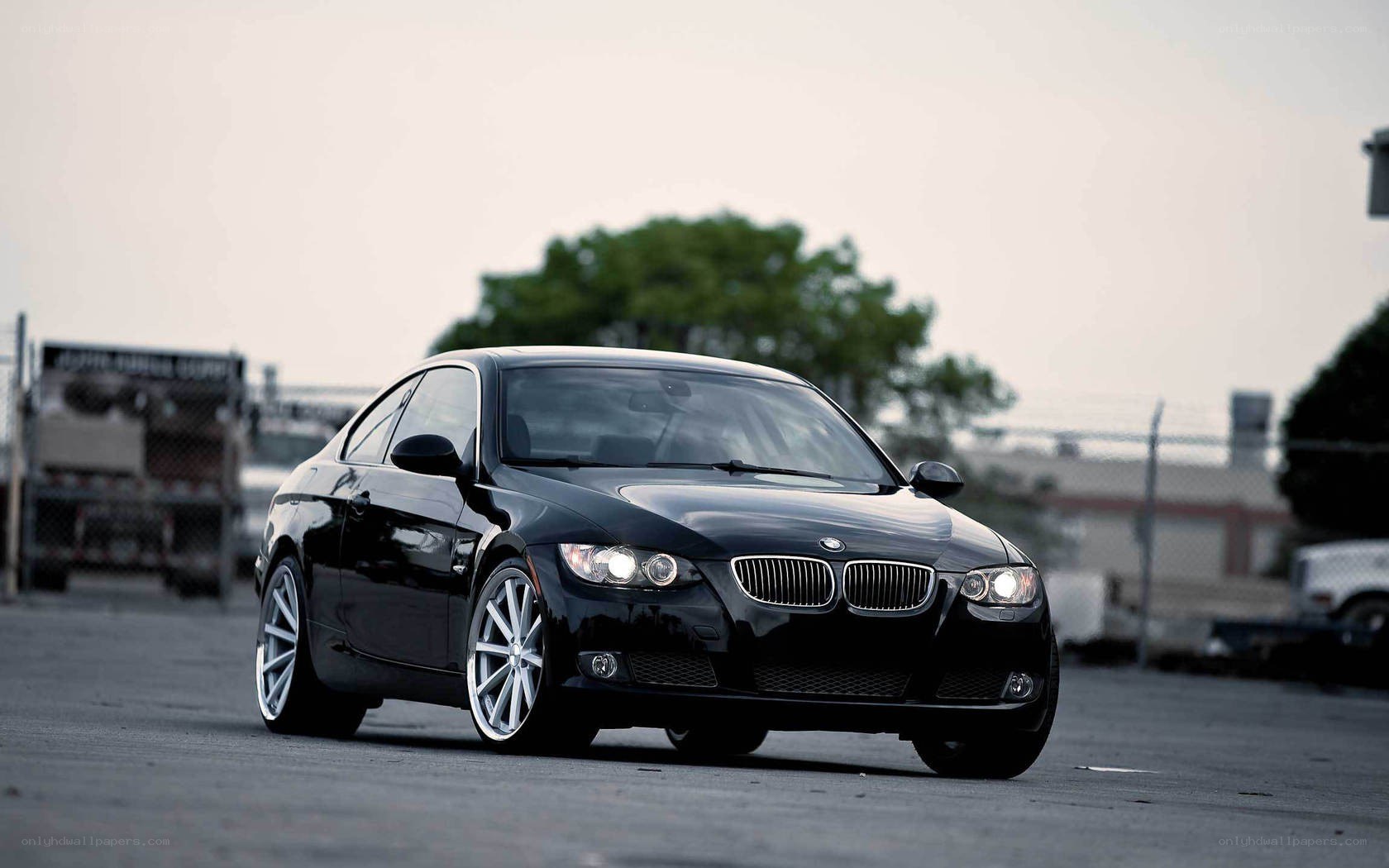 black bmw coupe on asphalt
