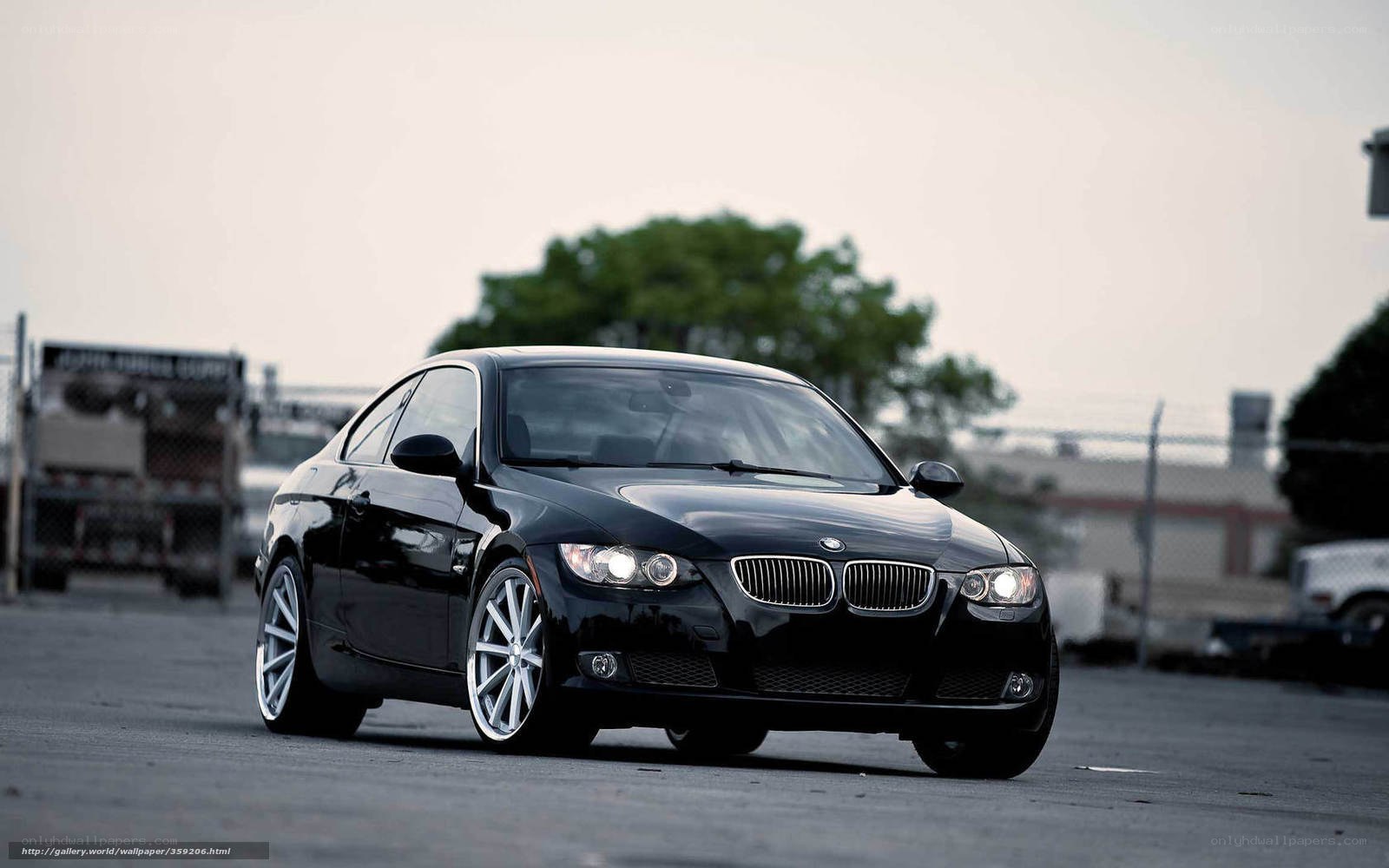 Black BMW coupe on asphalt