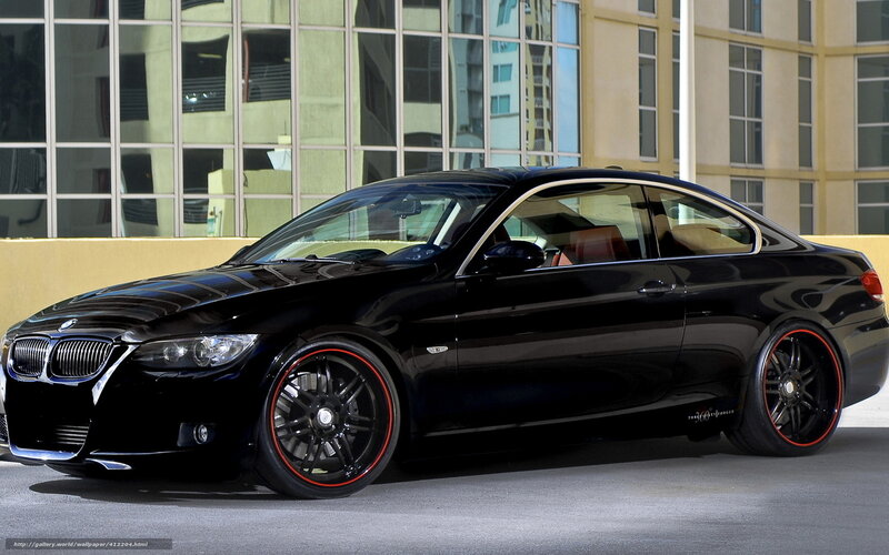 Black BMW coupe on city street