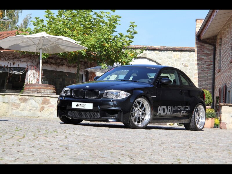Black BMW coupe on cobblestones