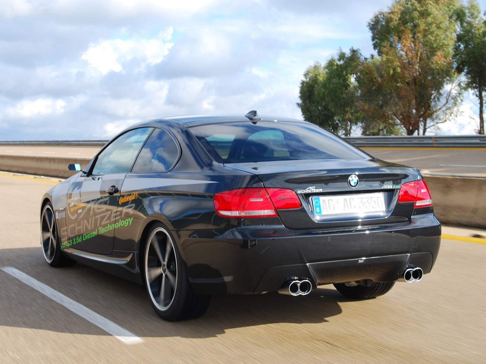 black bmw coupe on highway