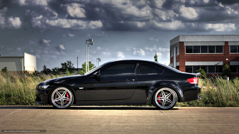 Black BMW coupe on pavement