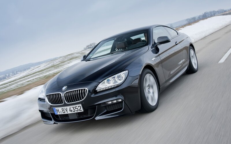 black bmw coupe on road