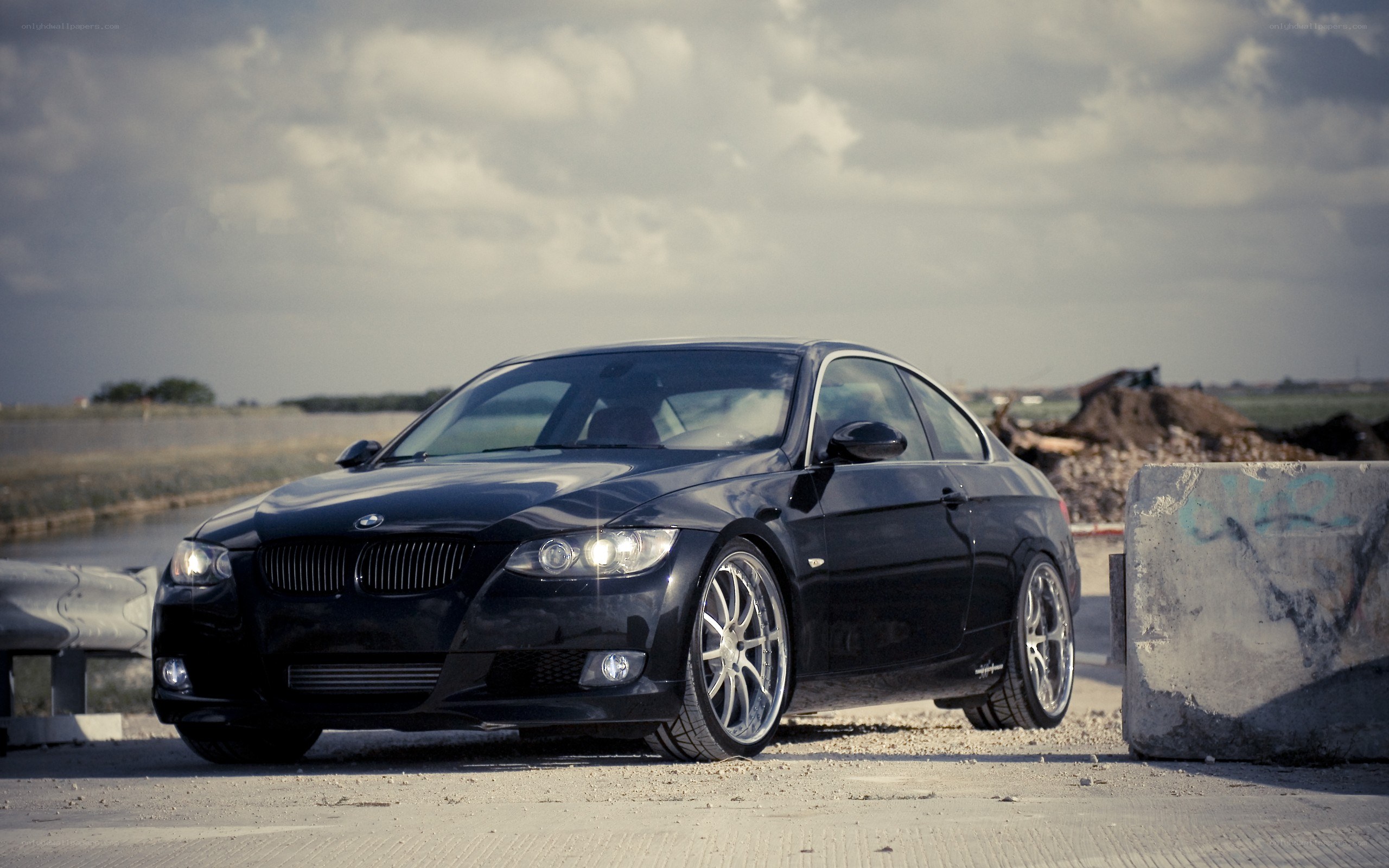 black bmw coupe on road