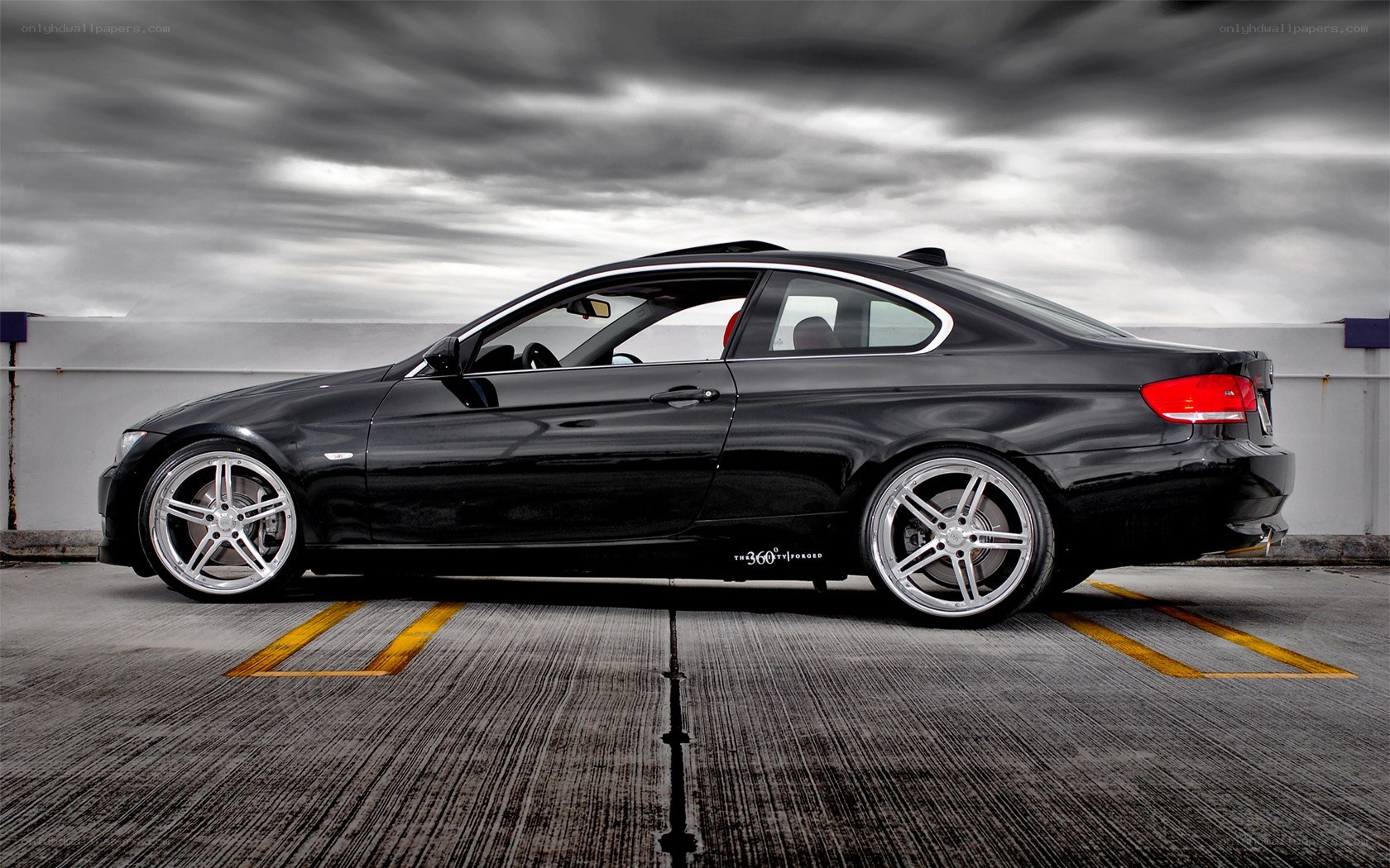 black bmw coupe on rooftop