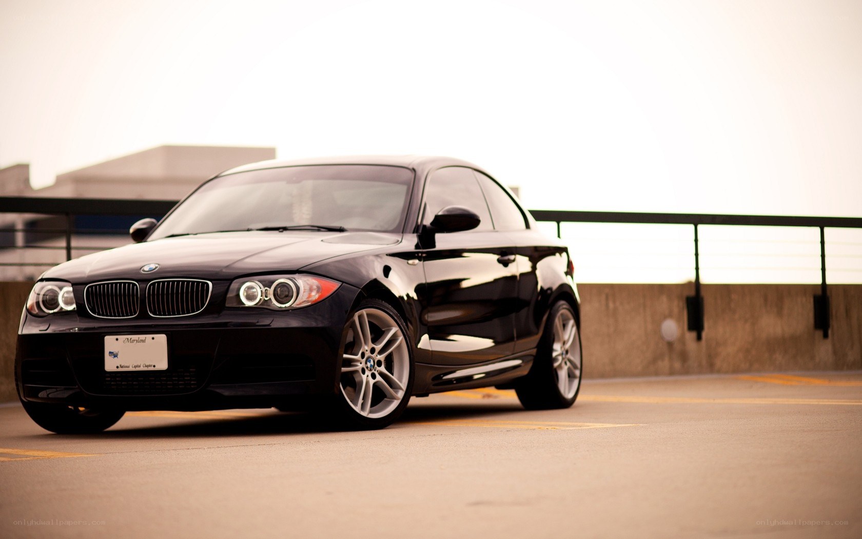 Black BMW coupe on rooftop