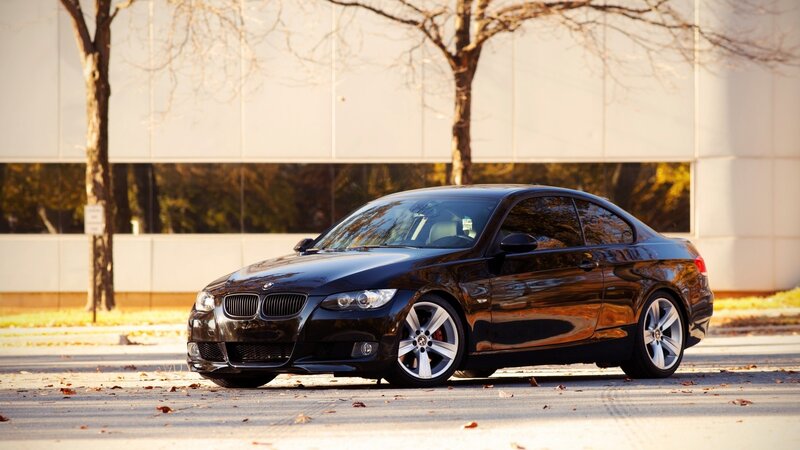 black bmw coupe on street