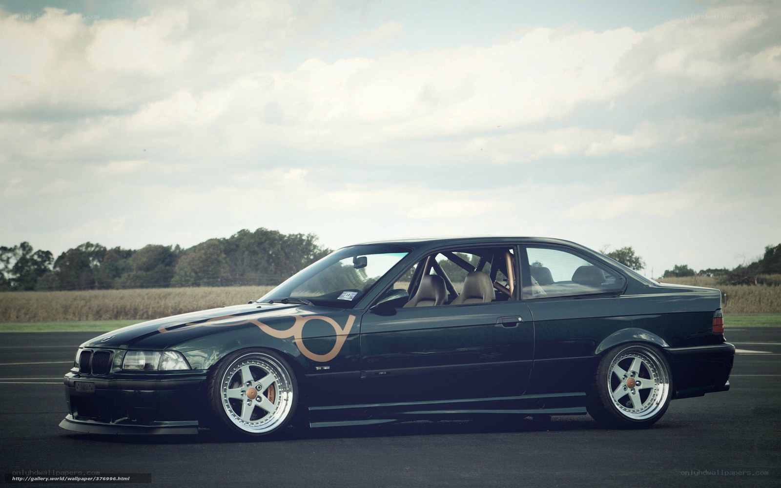 black bmw coupe on track