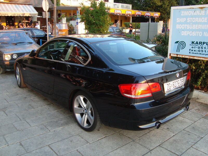 Black BMW coupe parked on street