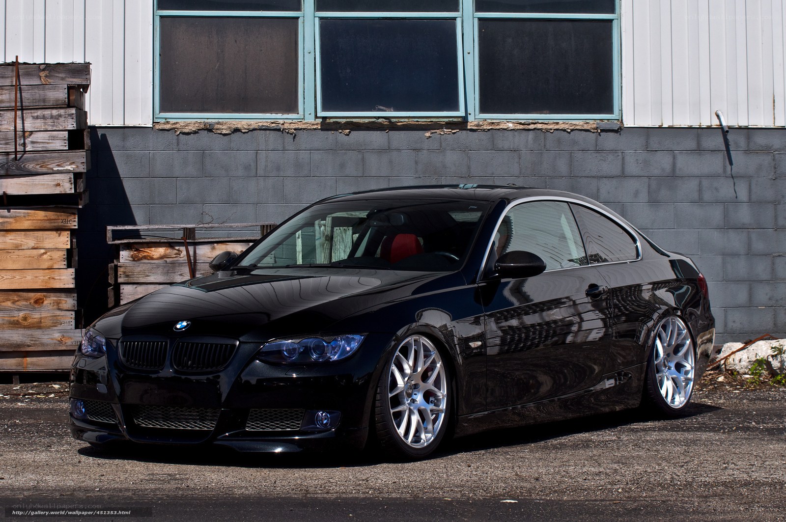 Black BMW coupe parked outside