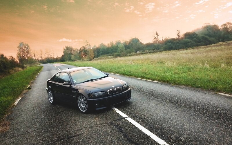 Black BMW Coupe — Serene, Sunset