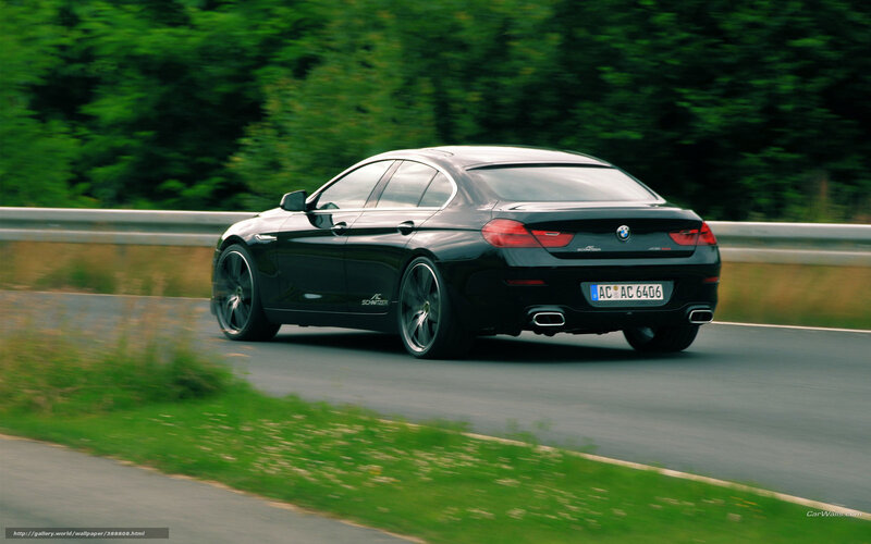 black bmw driving on road