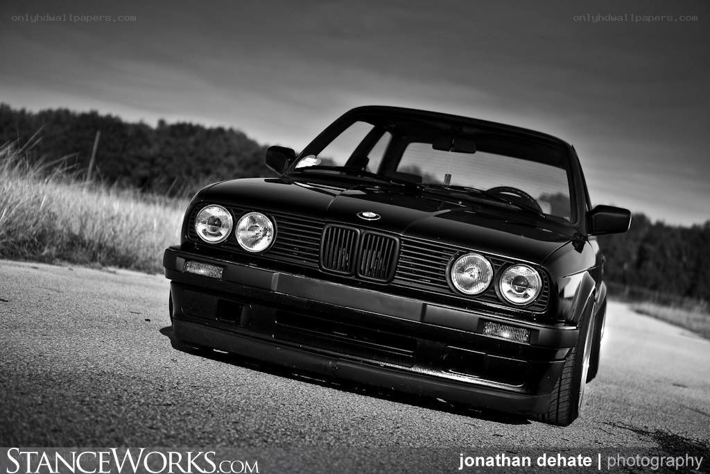 black bmw e30 on road